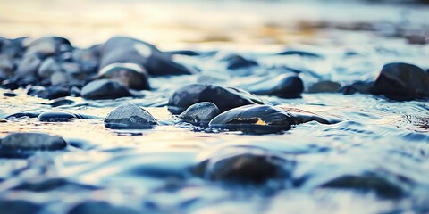 Canvas Print - Mountain stream, close-up on flowing water and smooth pebbles, soft focus background, twilight lighting. 