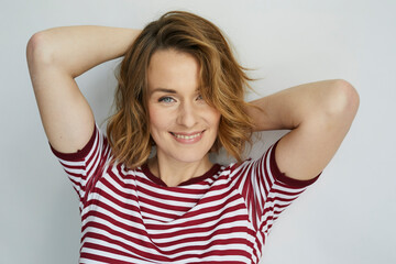 Portrait of smiling woman wearing red-white striped t-shirt