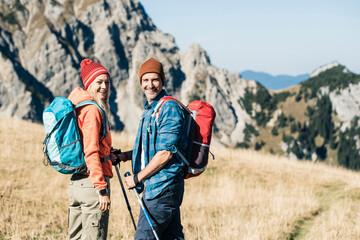 Wall Mural - Austria, Tyrol, happy couple on a hiking trip in the mountains