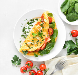 Canvas Print - Stuffed omelette with tomatoes and spinach