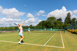 © tunedin - Mature women during a tennis match on grass court
