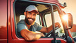 © Alberto Masnovo - Portrait of a happy smiling male truck driver inside his red cargo truck looking at camera with his blue baseball cap. Generative Ai.