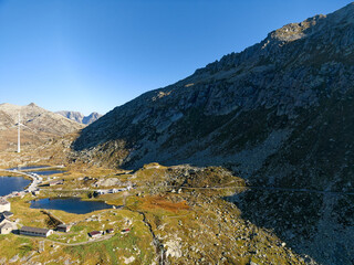 Wall Mural - Aerial view of summit of famous Swiss mountain Pass Gotthard on a sunny late summer morning. Photo taken September 10th, 2023, Gotthard, Switzerland.