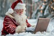 © Sandu - Santa on laptop in snow