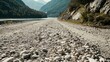© Thanthara - Gravel road leading to a mountain lake, close-up, natural gravel and stones, tranquil and untouched, no people