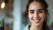 © Promila - young woman with flawless teeth showing a radiant smile in a sleek dental office