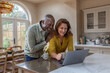 © ReeldealHD images - Happy senior couple looking at personal finances