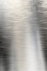 Wall Mural - abstract close-up of brushed metal surface, showcasing texture, light reflection, and movement. idea