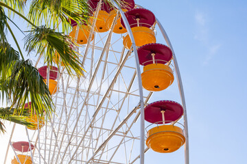 Scenic view of colorful Ferries wheel in Le Lavandou in south of France during hot summer day