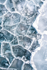 Wall Mural - Aerial view of a frozen lake, capturing the intricate cracks and patterns formed in the ice. Emphasize the clean, sharp lines and the subtle variations in the ice texture. 
