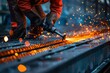 © Valentin - Person hammering metal