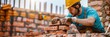 © Shutter2U - A bricklayer working on a construction site, highlights industry and craftsmanship, with copy space