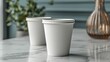 © DX - white paper coffee cups on white marble table