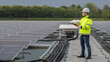 © reewungjunerr - Engineer working at floating solar farm,checking and maintenance with solar batteries near solar panels,supervisor Check the system at the solar power station