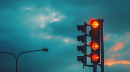 Fototapete - A close-up of a traffic light with an overcast sky in the background, symbolizing the predictability of traffic patterns