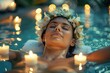 © Sandu - Woman in pool surrounded by floating candles