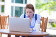 © pathdoc - Angry frustrated young businesswoman with working on a laptop.
