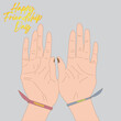 © Ibrahim - International Friendship Day, hands with friendship belt.  typography of Happy Friendship Day, Vector illustration isolated on a grey background,