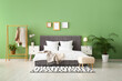 © Pixel-Shot - Comfortable bed, pillows and bedside tables in stylish bedroom