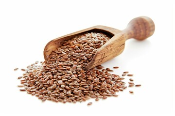 Sticker - Flax seeds in scoop on white background