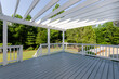 © Bryan - Bright Spacious Outdoor Wooden Deck with Open Ceiling Overlooking Back Yard