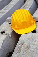 Wall Mural - yellow helmet on a work site