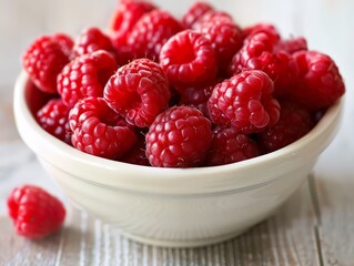 Canvas Print - fresh ripe raspberries in a white bowl