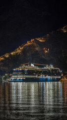 Wall Mural - Cruise ship sails in the Bay of Kotor. at night