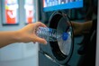 © Mountain Fairy - Reverse vending machine. Woman hand put empty plastic bottle in the machine. Reverse vending machine for refund and recycling metal drink cans, plastic and glass, Generative AI