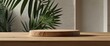 © ezra - Minimal natural wood podium with green palm leaf with sunlight background. Minimal wooden stand for branding and packaging presentation
