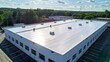 © visoot - Seamless white PVC commercial flat roof of factory, summer day. Aerial high view. Generative AI.