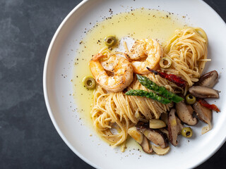 Wall Mural - Oil pasta with mushrooms on a plate	