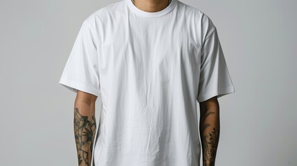Wall Mural - Pure white oversized crew neck loose t-shirt worn by an Asian man isolated on white