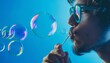 © Paulius - Bubbles in Blue: Capturing the Delicate Art of Soap Bubble Blowing