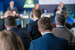 © Anton Gvozdikov - Attendees listening attentively to speakers at a business conference. Professionals engaging in corporate discussions during a panel discussion.