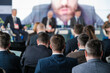 © Anton Gvozdikov - Audience at a business conference event listening to speakers on stage. Professional gathering discussing various topics.