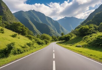 an empty road with mountains in the background