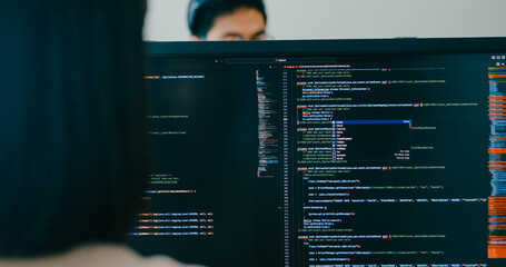 Closeup Adult Asia male, female freelance typing write prompt AI bot IT app smart program nomad, video game, terminal with coding language, user interface, designer, big data center desktop computer.