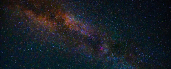 Wall Mural - background with night starry sky with milky way and bright stars. Panorama, panoramic wide cover with copy space
