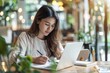 © Sandu - Female at desk with laptop and notepad