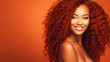 © ALA - Beautiful, sexy, happy smiling dark-skinned African American woman with perfect skin and red hair, on a red background, banner.