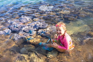 Wall Mural - Child snorkeling. Kids underwater. Beach and sea.