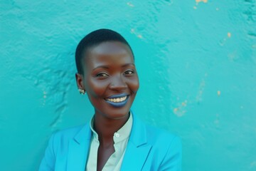 Wall Mural - A smiling woman wearing a blue jacket and white shirt, a casual everyday moment