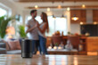 © Michael - Family young couple dancing in the kitchen, blurred focus