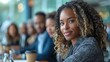 © AImg - Confident black businesswoman smiles at meeting table portrait image. Colleagues diversity picture photorealistic photography. Professionalism collaboration concept photo realistic