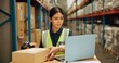 © N Lawrenson/peopleimages.com - Laptop, qr code and inventory with woman scanning box in warehouse for shipping or delivery. Computer, stock and online order with young person working in warehouse for supply chain logistics