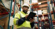 © N Lawrenson/peopleimages.com - Warehouse, black man and manufacturing with tablet, inventory and checklist in a factory. African person, worker and employee with tech and inspection with digital app for logistics and online stock