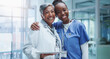 © peopleimages.com - Portrait, doctor hug and nurse woman in hospital with smile for healthcare, collaboration or support. Embrace, medical team and professional health workers for happiness, teamwork or solidarity