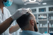 © Di Studio - doctor making hair transplantation on the male head