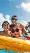 © sommersby - A happy family enjoys a sunny day by floating in a pool